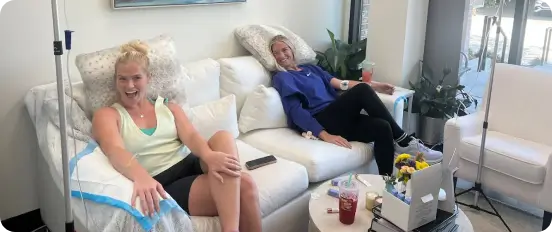 Anti-aging and regenerative wellness treatments in a Hydrate GA clinical suite in Athens. Designed as a soft-healing sanctuary with plush seating to support nervous system relaxation during treatments.