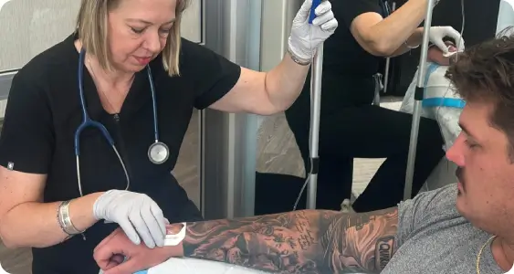 Lisa Kubiak, RN administering IV nutritional therapy for 100% bioavailability and cellular rehydration at Hydrate GA wellness clinic in Athens, GA.